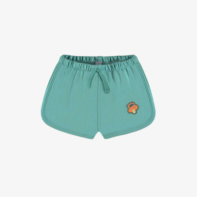 Short vert en coton français, naissance