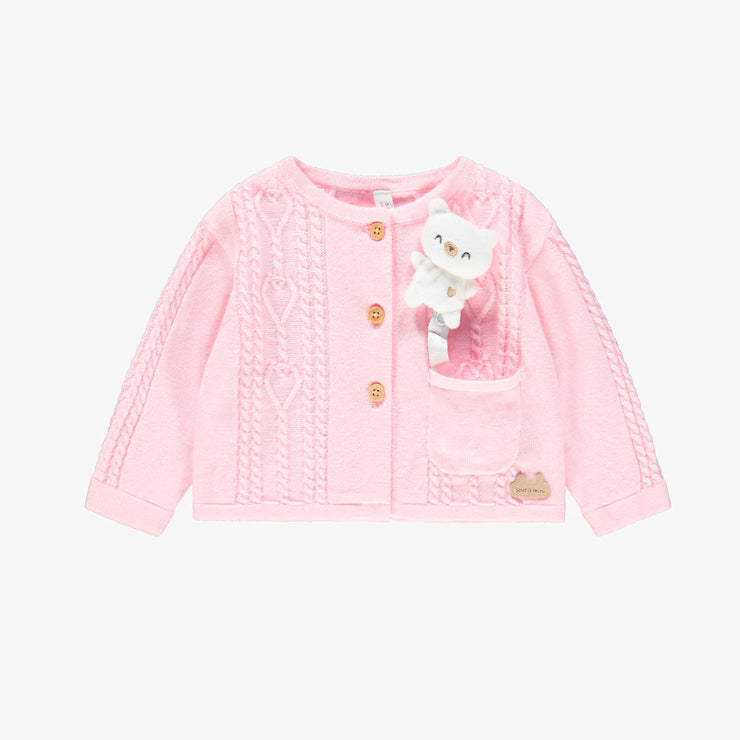 Cardigan rose en tricot, naissance