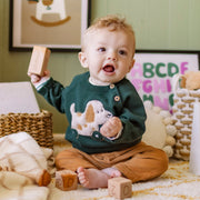 Pantalon brun en velours côtelé, naissance