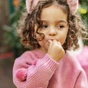 Photo d'un bébé portant le chandail rose scintillant en tricot, bébé