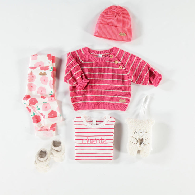 Chandail rose en tricot, naissance