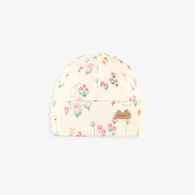 Bonnet crème à motifs, naissance