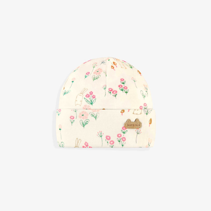 Bonnet crème à motifs, naissance