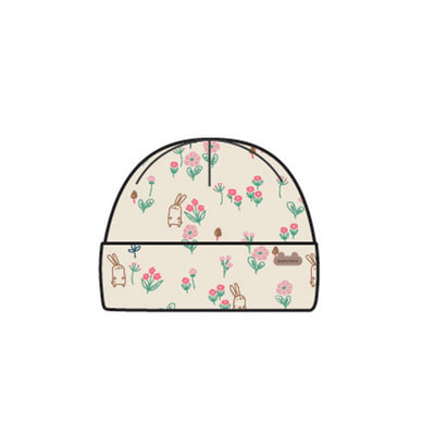 Bonnet crème à motifs, naissance