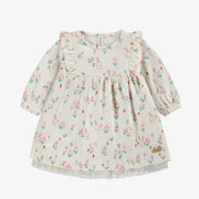 Robe crème à motifs, naissance