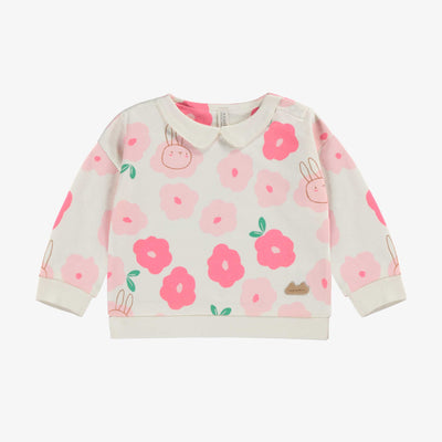 Chandail crème à motif floral, naissance