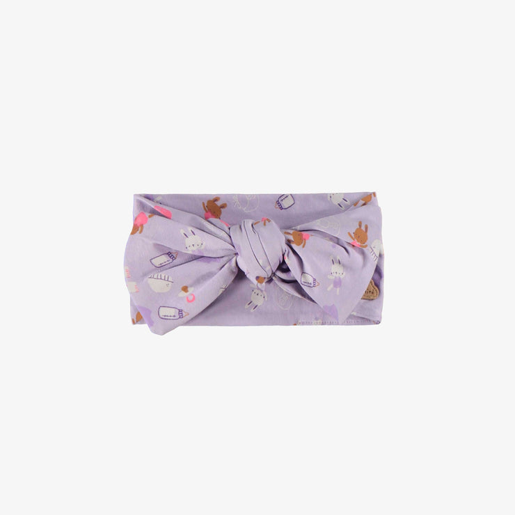 Bandeau mauve à motifs, naissance