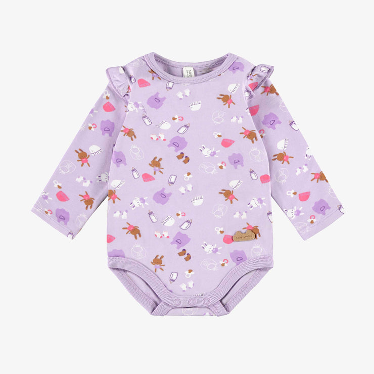 Cache-couche mauve à motifs, naissance