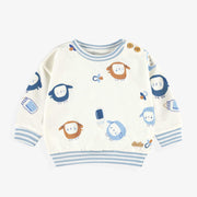 Chandail crème à motifs, naissance
