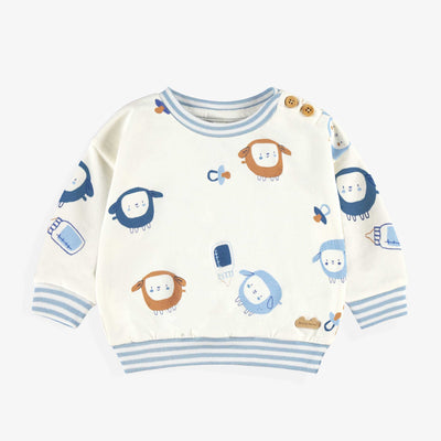 Chandail crème à motifs, naissance