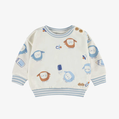 Chandail crème à motifs, naissance