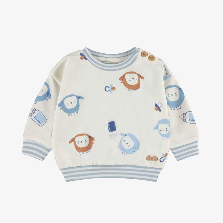 Chandail crème à motifs, naissance