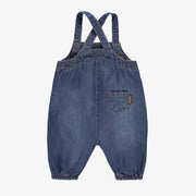 Salopette bleue en denim, naissance