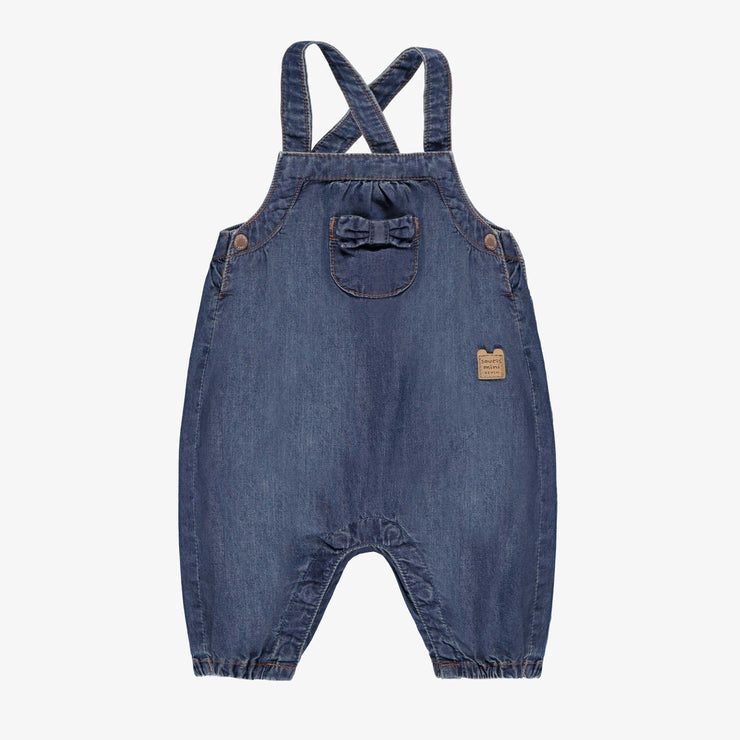 Salopette bleue en denim, naissance