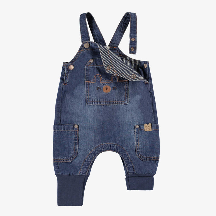Salopette bleue en denim, naissance