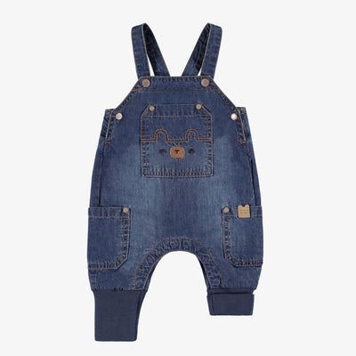 Salopette bleue en denim, naissance