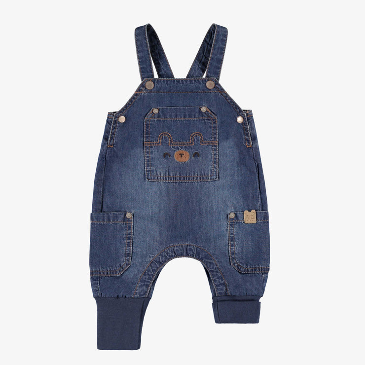 Salopette bleue en denim, naissance