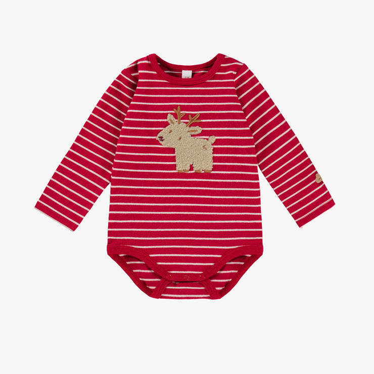 Cache-couche rouge à rayures, naissance